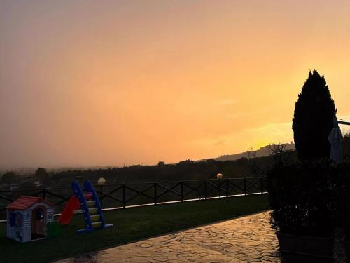 a view of a sunset from a park with a playground at Apartment in Tuscany near Montecatini Golf Club in Larciano