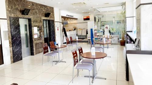 a restaurant with tables and chairs in a room at Toyoko Inn Nagano eki Zenkoji guchi in Nagano