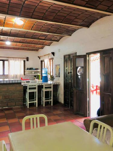 a kitchen with a table and chairs in a room at Sayulita Beach House Hotel in Sayulita