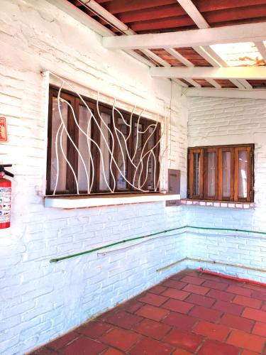 a room with a wall with a stained glass window at Sayulita Beach House Hotel in Sayulita
