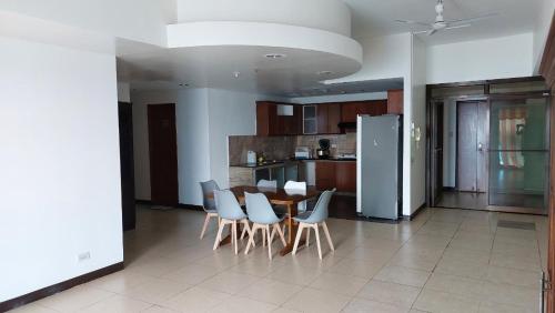 a kitchen and dining room with a table and chairs at MANILA BAY EXECUTIVE SUITE pearl of orient in Manila