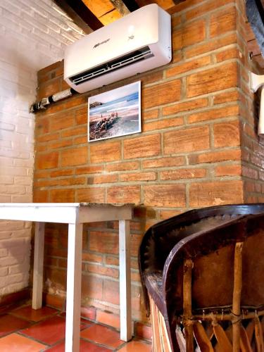 a wall with a white table and a air conditioner at Sayulita Beach House Hotel in Sayulita