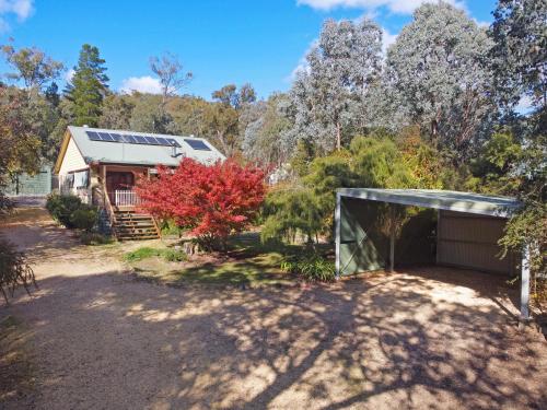 a home with a garage and a house with solar panels at Jamieson Getaway in Jamieson