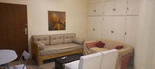 a living room with a couch and a table at ApartFlorida3 in Buenos Aires