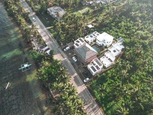an aerial view of a house with palm trees at Hostel Bajala Siargao in General Luna