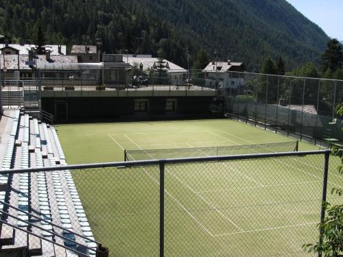 a tennis court with a tennis racket on it at Miramonti in Valtournenche