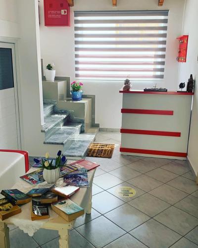 a living room with a table in a room at Vila Reni Risi in Ksamil