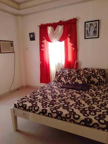 Postel nebo postele na pokoji v ubytování Room in Lobo Triple N Home stay 1st N
