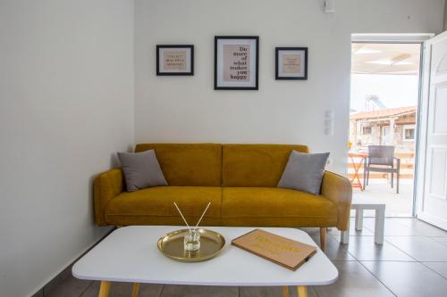 a living room with a couch and a table at heaven suite elafonisi in Elafonisi