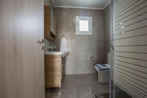 a bathroom with a sink and a toilet at heaven suite elafonisi in Elafonisi