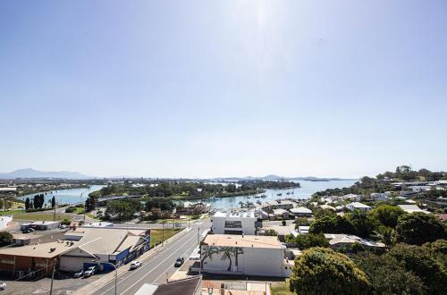 an aerial view of a town with a river at Curtis Central Apartments Official in Gladstone