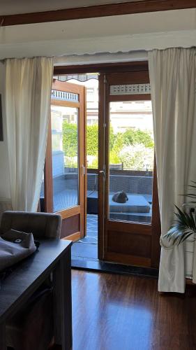 an open door to a room with a patio at Casa di Lauza in Valkenburg