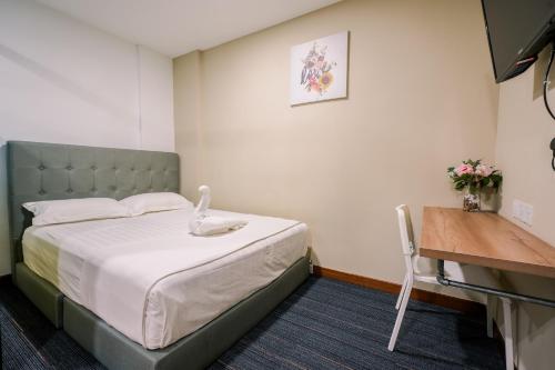 Postel nebo postele na pokoji v ubytování 3C HOTEL Setia Walk Puchong
