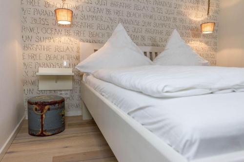 Postel nebo postele na pokoji v ubytování Wohnung-Surf