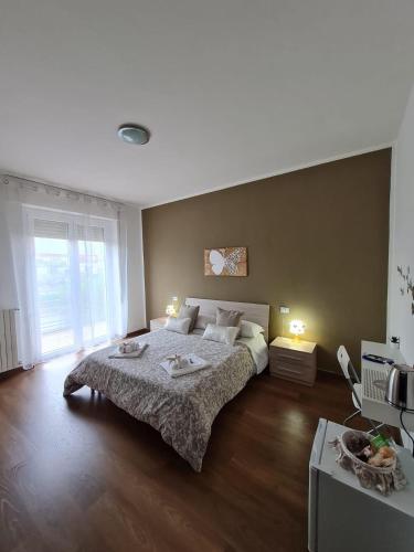 Ένα ή περισσότερα κρεβάτια σε δωμάτιο στο B&B Villa Luja Resort