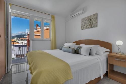 Posteľ alebo postele v izbe v ubytovaní Ana Apartment