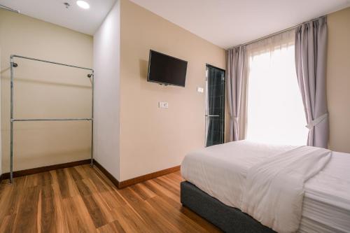 Postel nebo postele na pokoji v ubytování 3C HOTEL Setia Walk Puchong