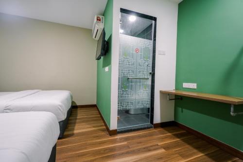 Postel nebo postele na pokoji v ubytování 3C HOTEL Setia Walk Puchong
