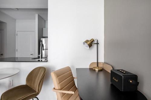 a dining room with a table and chairs at U Street 1br w gym wd nr metro dining WDC-676 in Washington