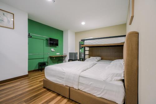 Postel nebo postele na pokoji v ubytování 3C HOTEL Setia Walk Puchong