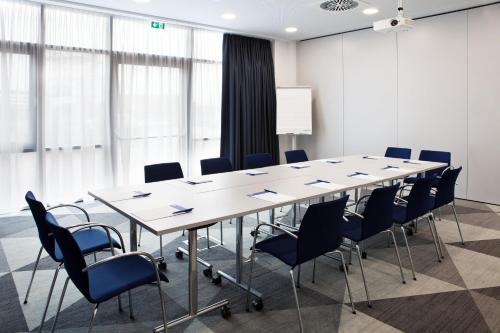 a conference room with a long table and chairs at Holiday Inn Express - Sindelfingen by IHG in Sindelfingen