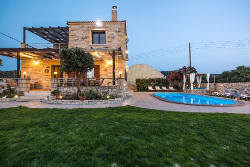 a house with a swimming pool in a yard at Villa Archontissa in Análipsis
