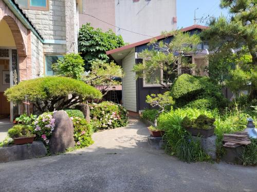 a garden in front of a house at JNW MINBAK in Damyang