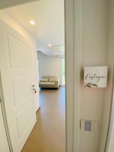 an open door to a living room with a couch at Sul VenTo del Po in Melara