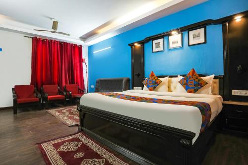 Ένα ή περισσότερα κρεβάτια σε δωμάτιο στο FabHotel Sentinel Suites