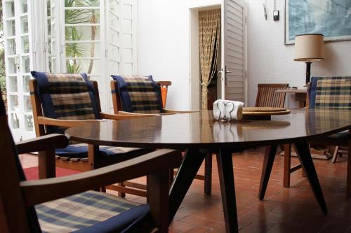 a dining room with a table and chairs at Villa Ela in Tribunj