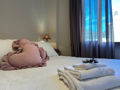 a bedroom with a bed with towels on it at Agave Marina in Marciana Marina