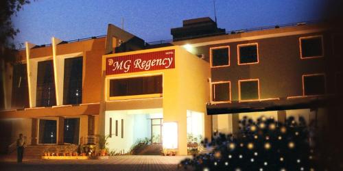 a building with a sign on the side of it at Mg Regency in Baddi