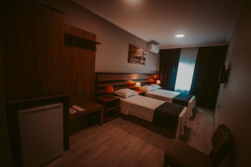 a hotel room with a bed and a television at MiLAROOM in Edirne