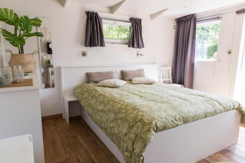 Postel nebo postele na pokoji v ubytování B&B Het Brembos