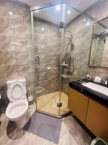 a bathroom with a shower and a toilet and a sink at R&F PRINCESS COVE at ANJU in Johor Bahru