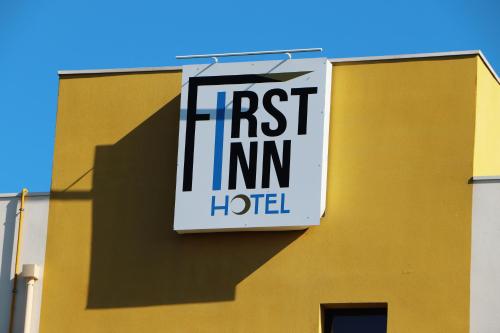 a firstmi hotel sign on the side of a building at First Inn Hotel Blois in Blois