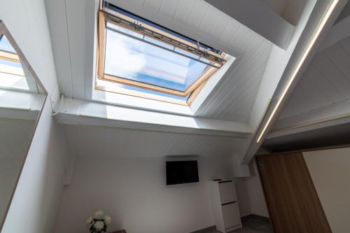 a skylight in a ceiling with a window at Villa Gina Case Vacanze in Roseto degli Abruzzi