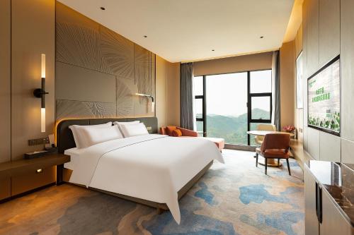 Katil atau katil-katil dalam bilik di Wyndham Garden Gaozhou
