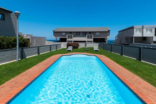 a swimming pool on the roof of a house at Frinton on Sea 2 in Ballito