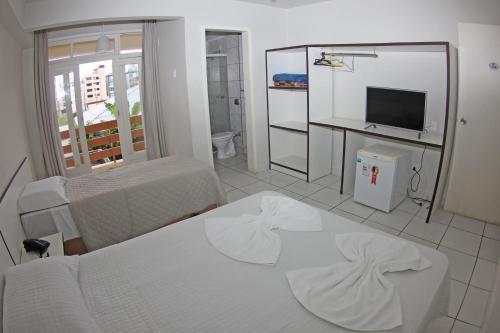 Katil atau katil-katil dalam bilik di Atlântico Sul Hotel
