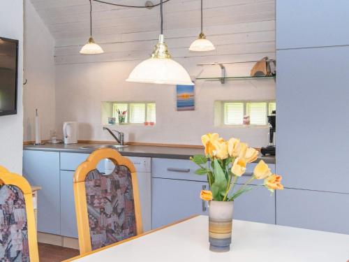 A kitchen or kitchenette at 6 person holiday home in Harbo re