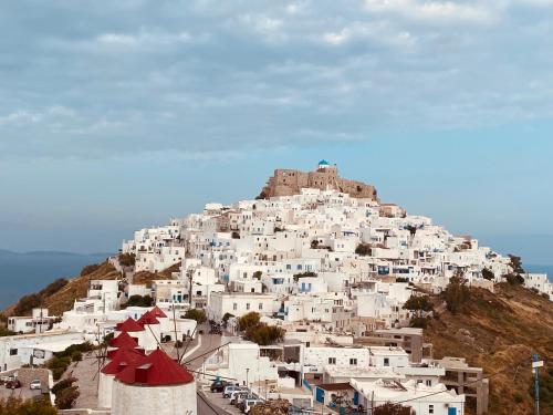 a town on a hill with white buildings at Arhodiko Studios in Astypalaia