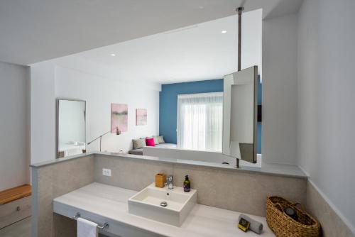 a bathroom with a sink and a mirror at Casa Manolesos in Chorafakia