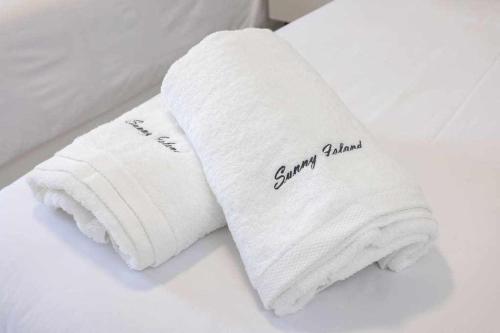 Ένα ή περισσότερα κρεβάτια σε δωμάτιο στο Sunnyland apartment arona