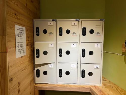 a group of boxes sitting on a shelf in a room at Gift Box Hostel in Chishang