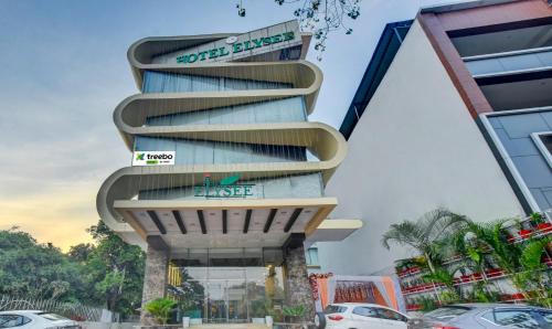 un montage du bâtiment blume de l'hôtel proposé dans l'établissement Treebo Trend Elysee - Patel Nagar, à Dehradun