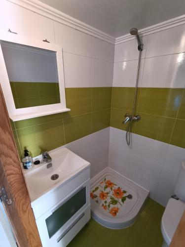 a bathroom with a sink and a toilet at Casa Antiuxía in Malpica