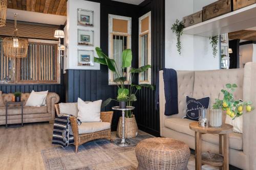 a living room with a couch and a chair at West Bay in Middelkerke