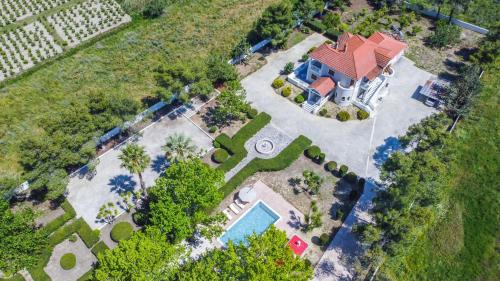 an overhead view of a house with a swimming pool at Adriana di Levante by "elite" in Ayios Kirikos
