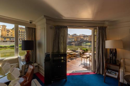 a hotel room with a view of a balcony at Hotel Lungarno - Lungarno Collection in Florence
